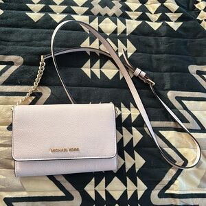 Pink MK crossbody with gold chain accents on strap